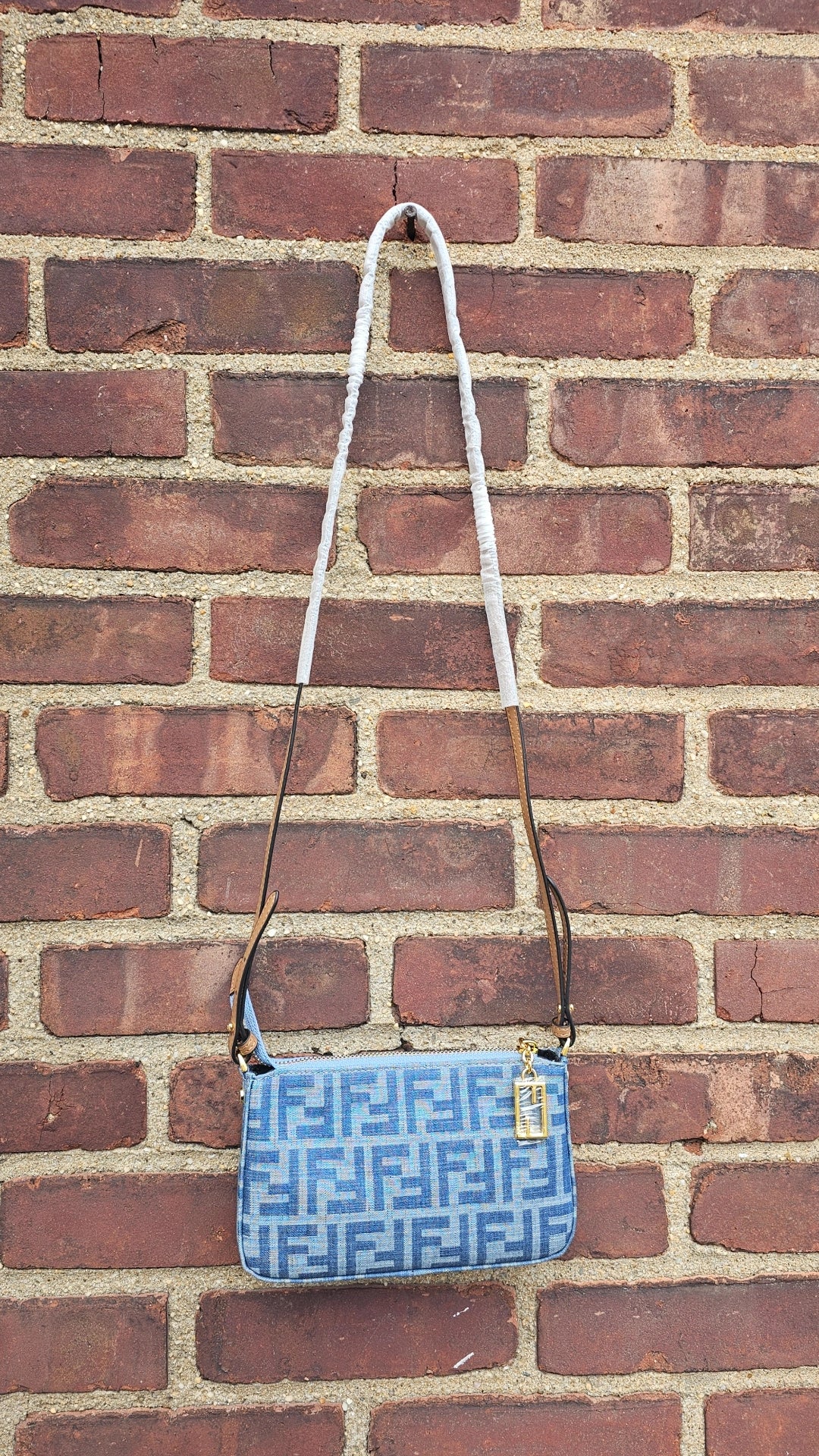 Denim Small F Crossbody with zipper in stock