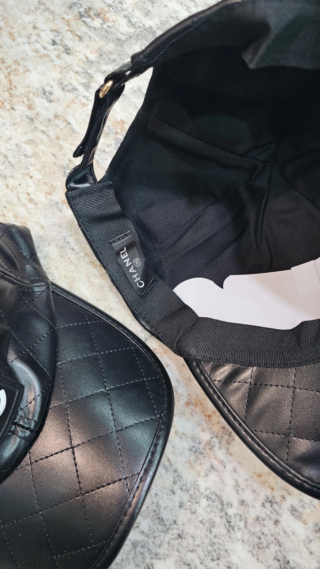 Black C faux leather cap