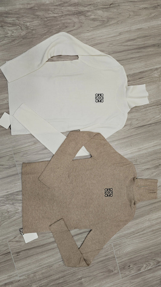 Taupe and white ribbed turtlenecks run small