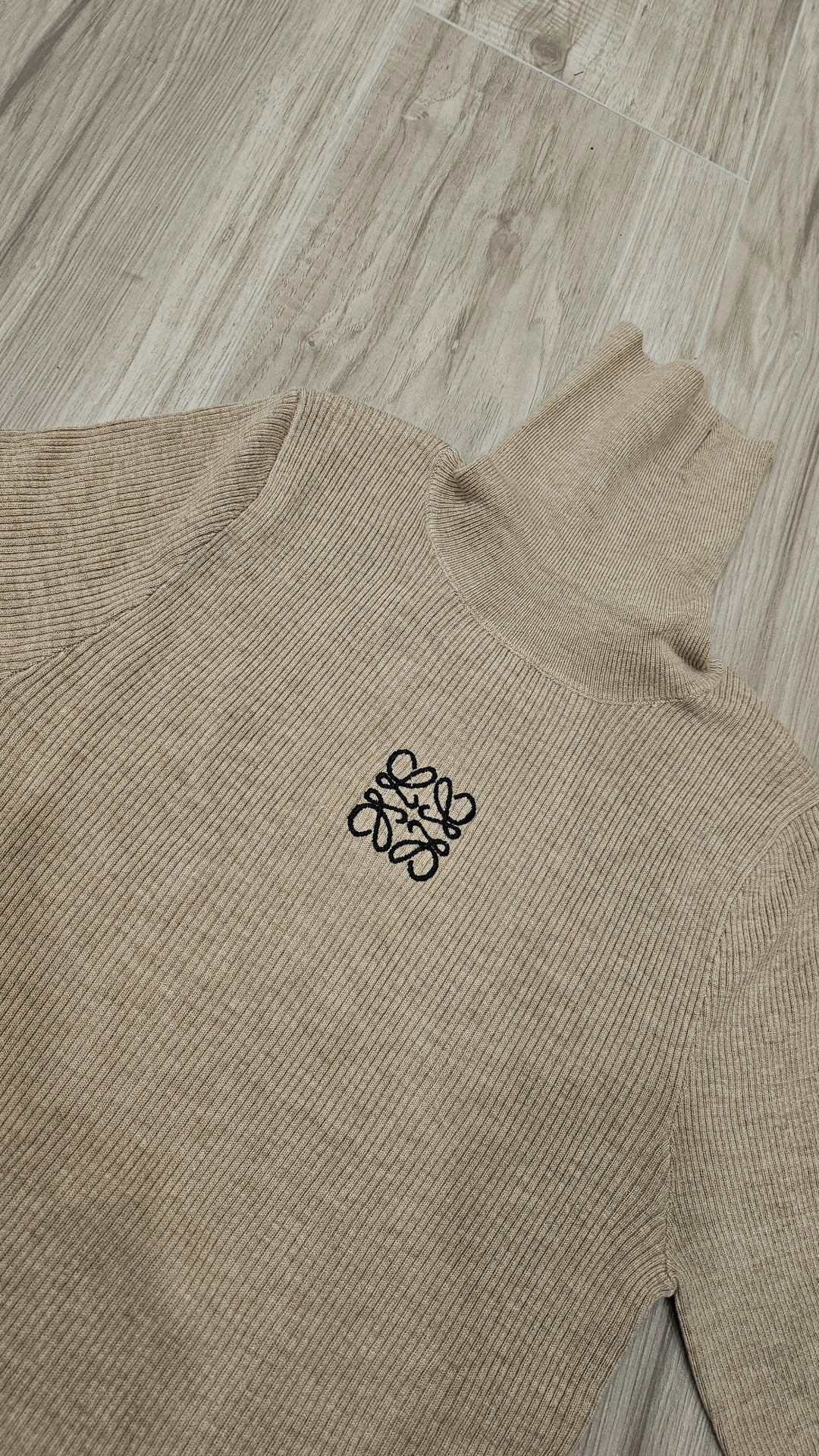 Taupe and white ribbed turtlenecks run small