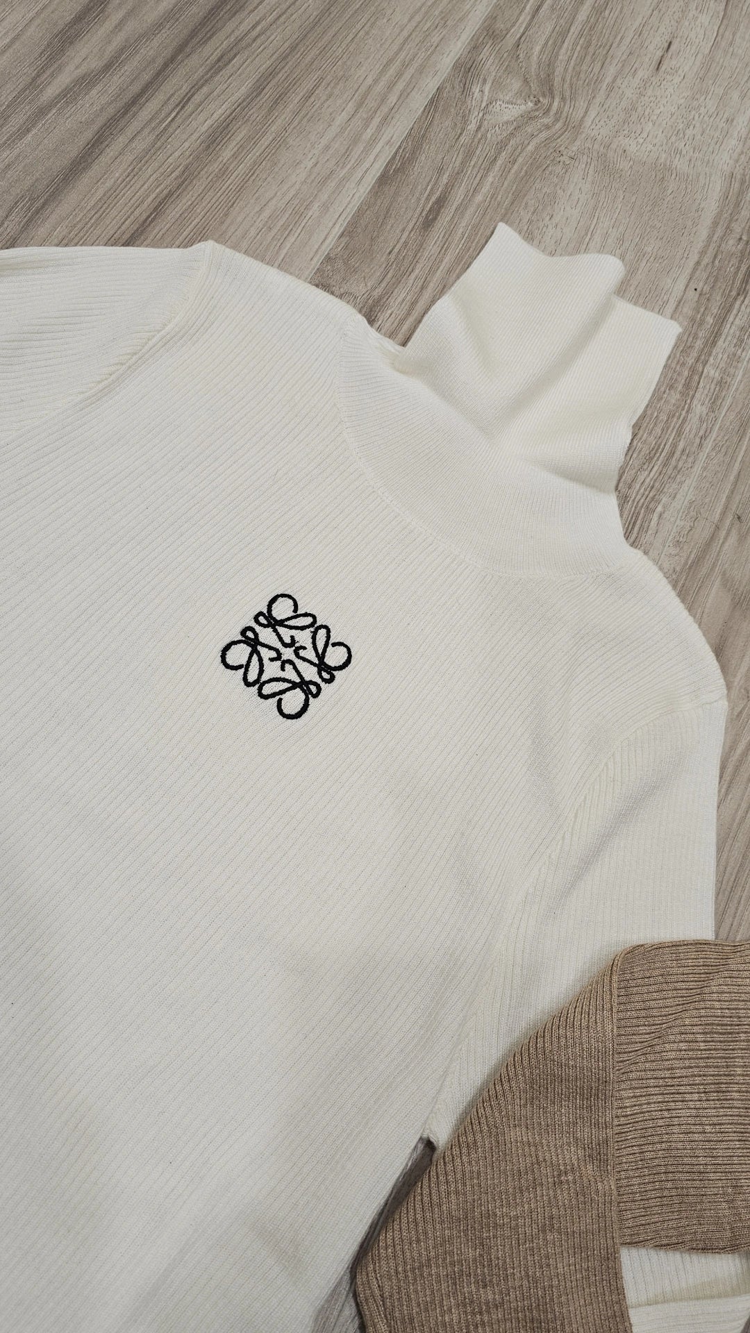 Taupe and white ribbed turtlenecks run small