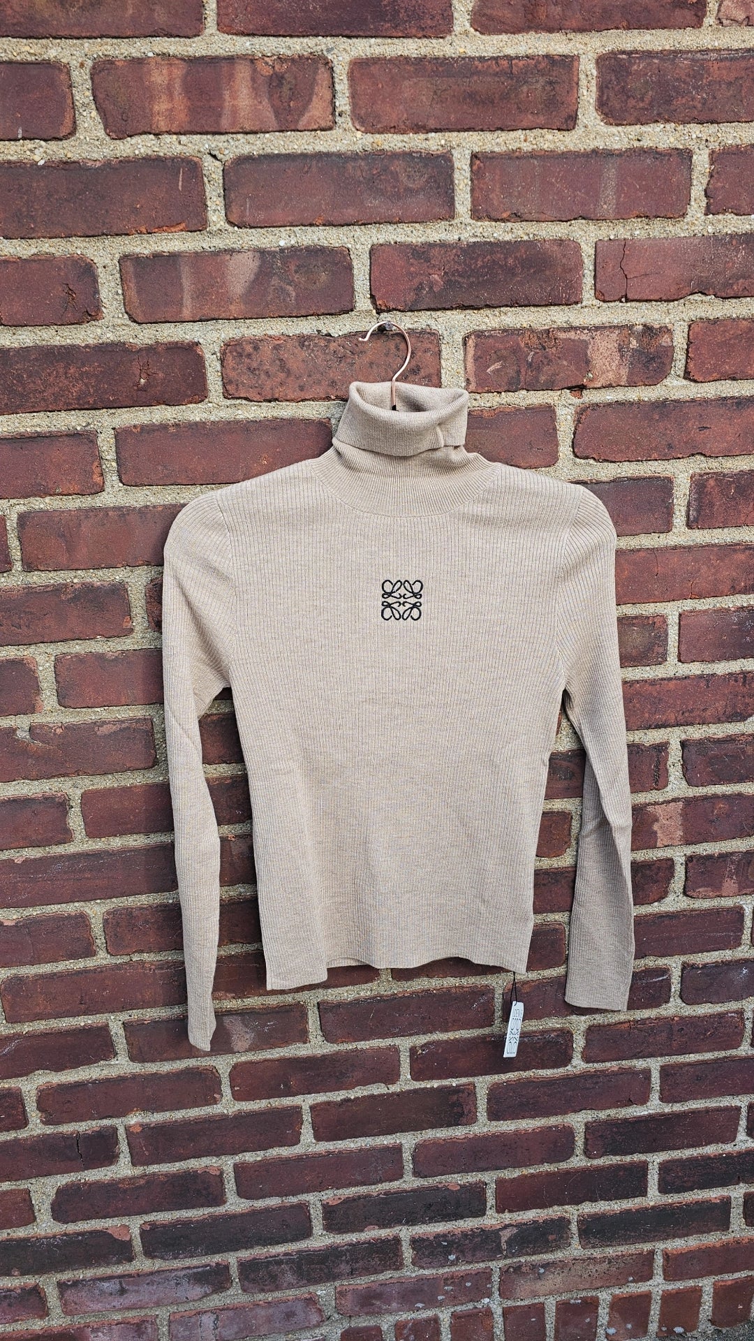 Taupe and white ribbed turtlenecks run small