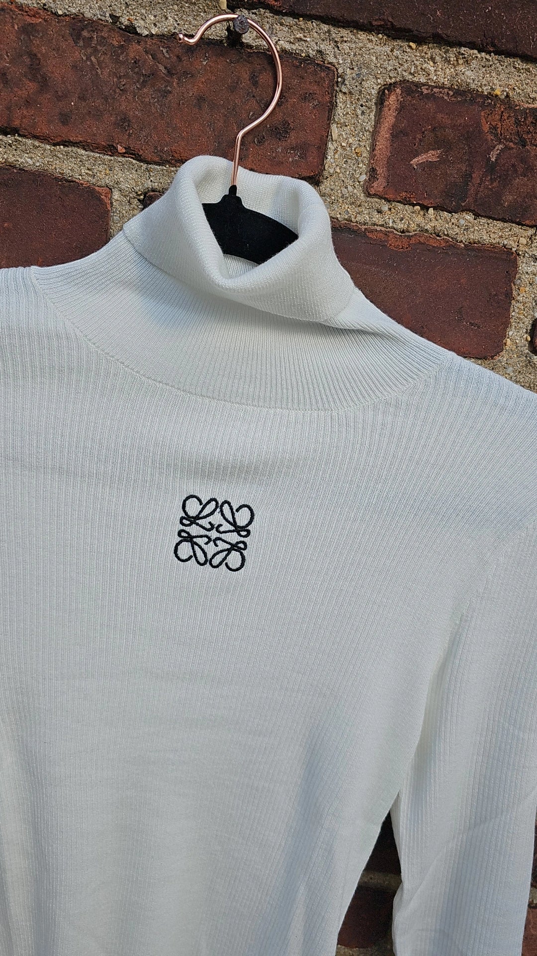 Taupe and white ribbed turtlenecks run small