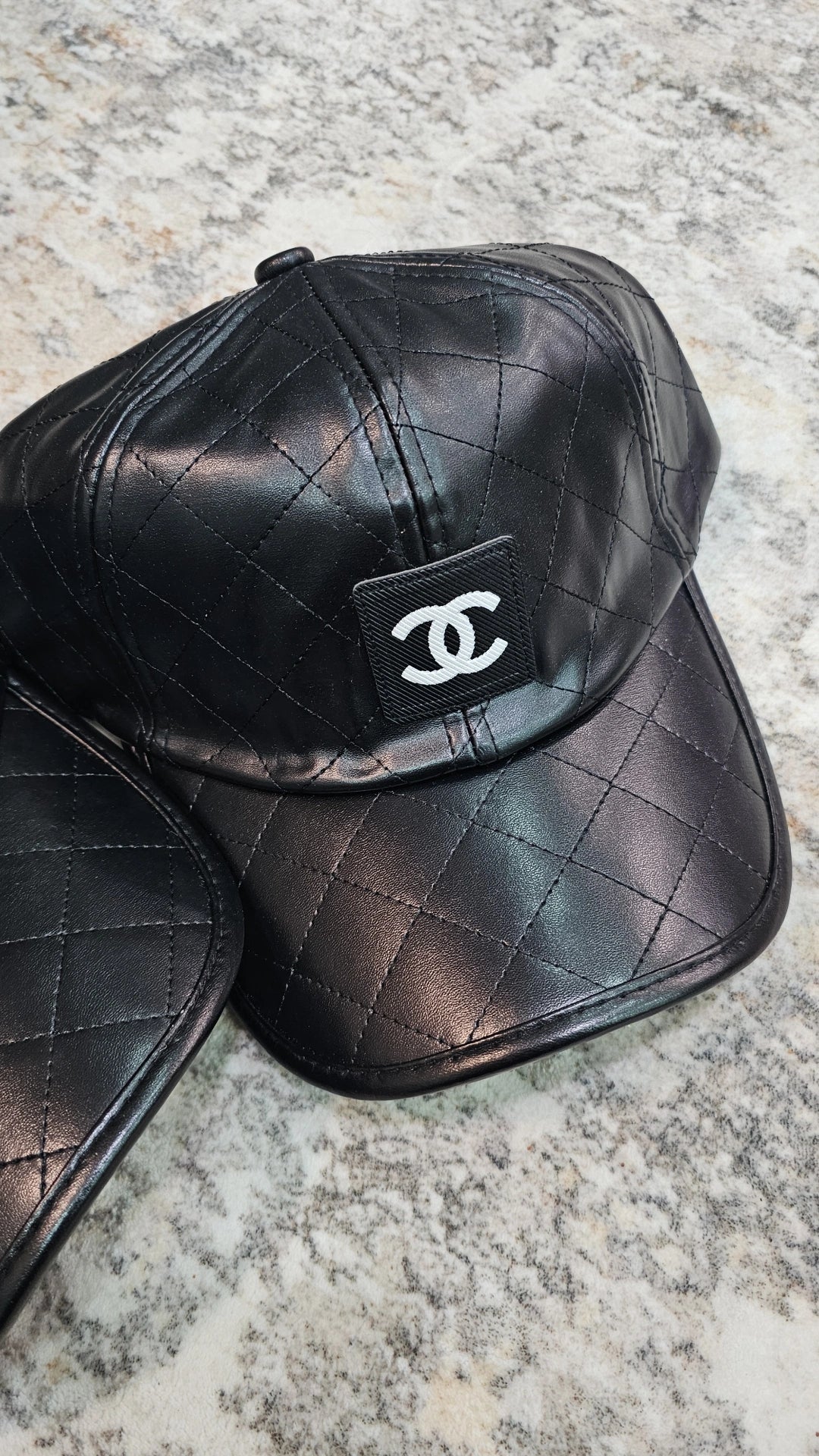 Black C faux leather cap