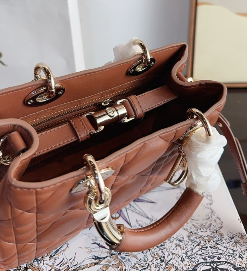Brown luggage D bag