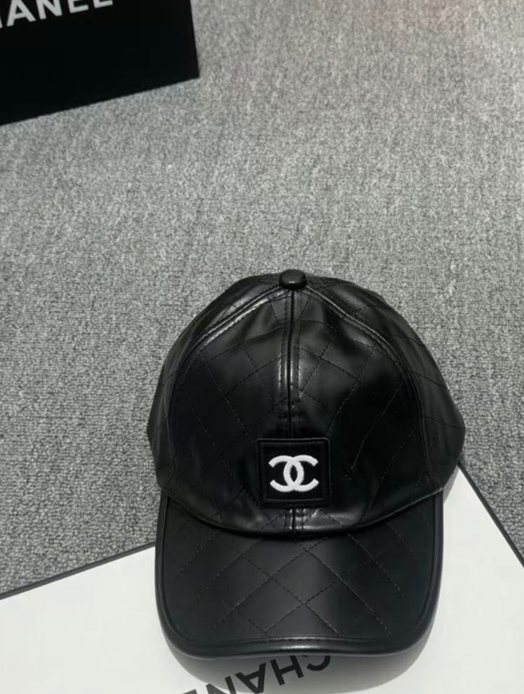 Black C faux leather cap